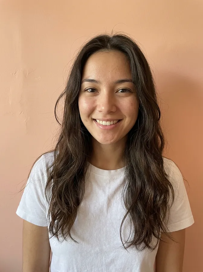 AI-generated portrait of a young woman with long wavy dark brown hair against a peach wall