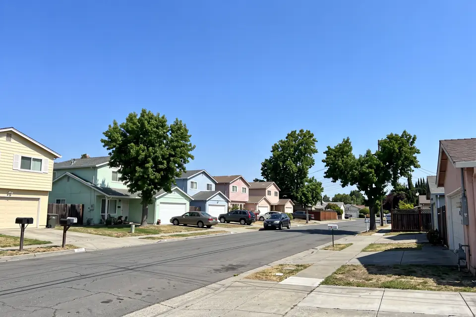 The same street with the pole and power lines removed
